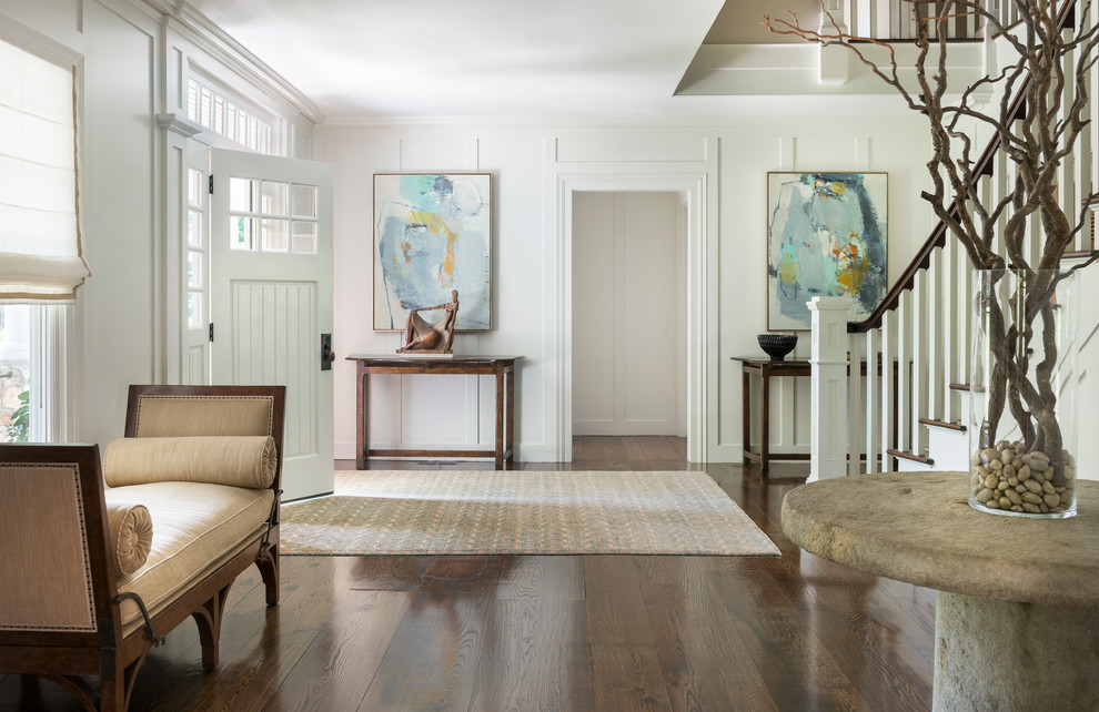 Design ideas for a transitional foyer in New York with white walls, dark hardwood floors, a single front door and a white front door.