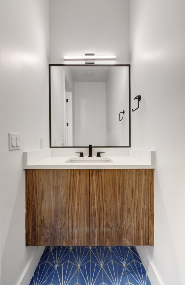 This is an example of a small modern cloakroom in Austin with flat-panel cabinets, dark wood cabinets, white tiles, cement tiles, white walls, cement flooring, a submerged sink, quartz worktops and blue floors.