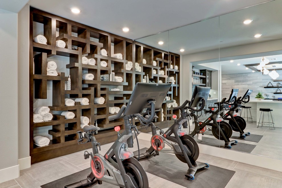 This is an example of a transitional multipurpose gym in Orange County with grey walls and grey floor.