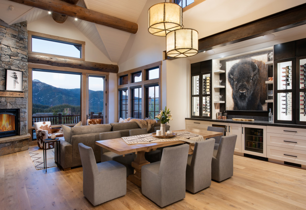 Mid-sized country open plan dining in Other with white walls, medium hardwood floors, brown floor and vaulted.