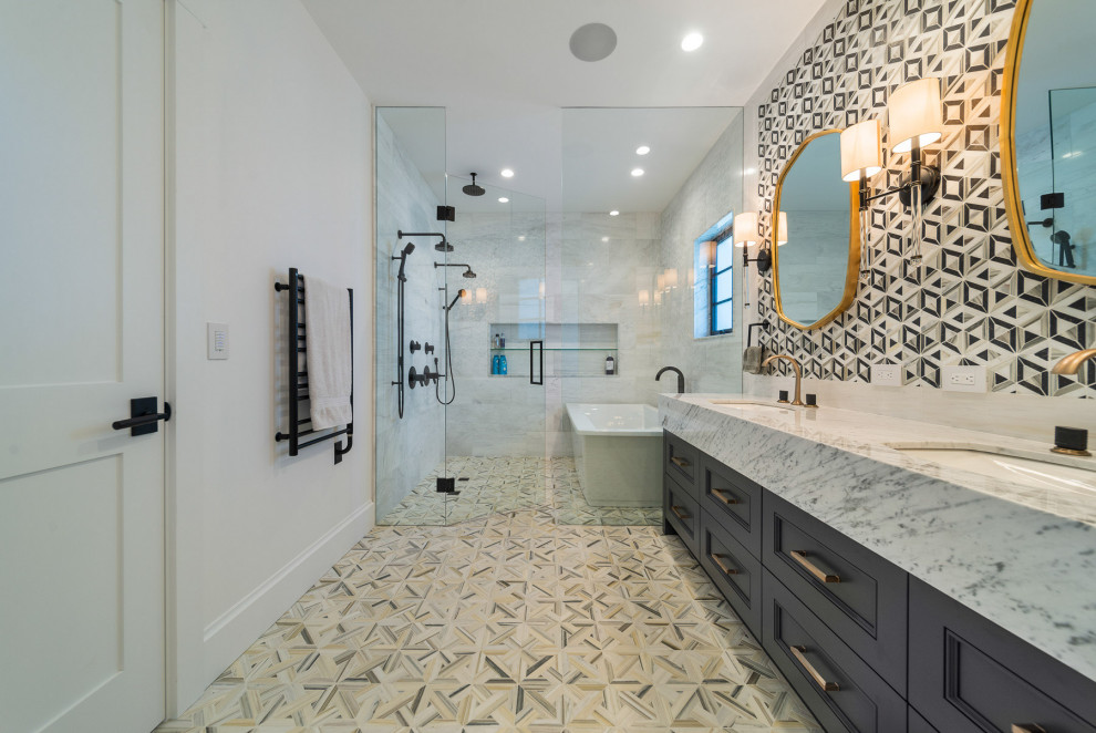 Inspiration for a transitional wet room bathroom in Vancouver with recessed-panel cabinets, grey cabinets, a freestanding tub, black and white tile, white walls, an undermount sink, beige floor, white benchtops, a niche, a double vanity and a freestanding vanity.
