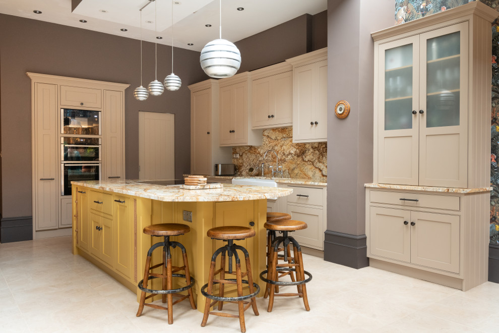 Expansive traditional galley eat-in kitchen in London with a double-bowl sink, beaded inset cabinets, brown cabinets, granite benchtops, yellow splashback, granite splashback, stainless steel appliances, ceramic floors, with island, white floor and yellow benchtop.