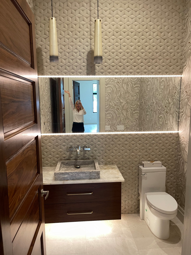 Inspiration for a medium sized modern cloakroom in Orlando with flat-panel cabinets, brown cabinets, a one-piece toilet, beige tiles, stone tiles, multi-coloured walls, marble flooring, a trough sink, quartz worktops, white floors, white worktops, a floating vanity unit, a wallpapered ceiling and wallpapered walls.
