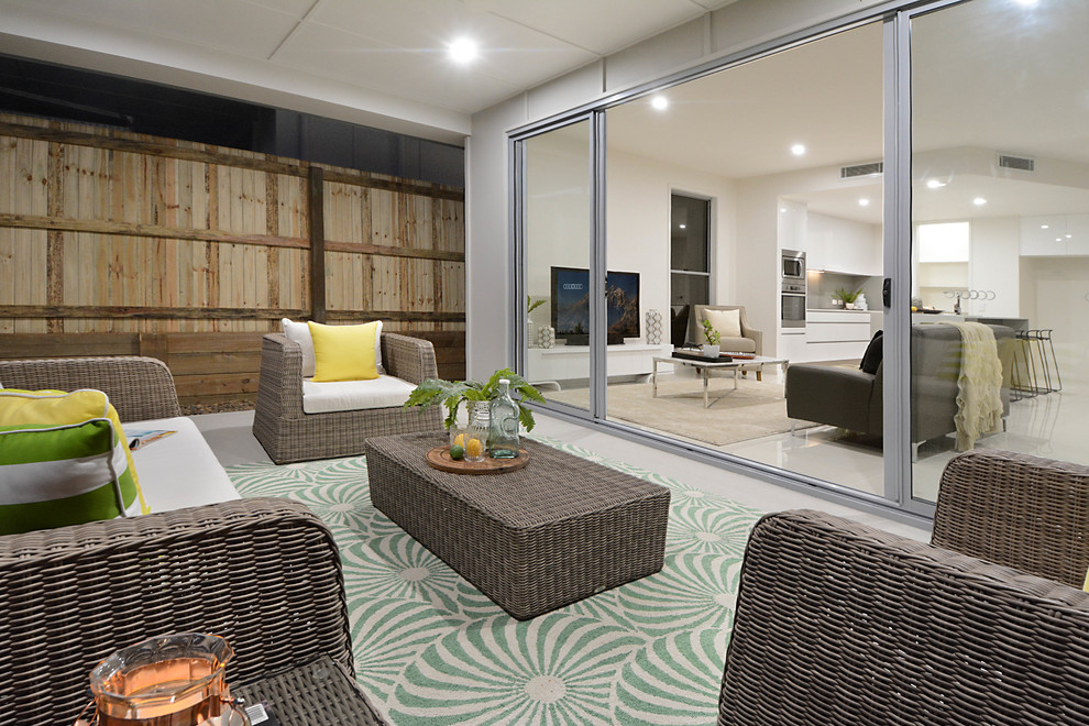 Design ideas for a mid-sized contemporary backyard patio in Brisbane.