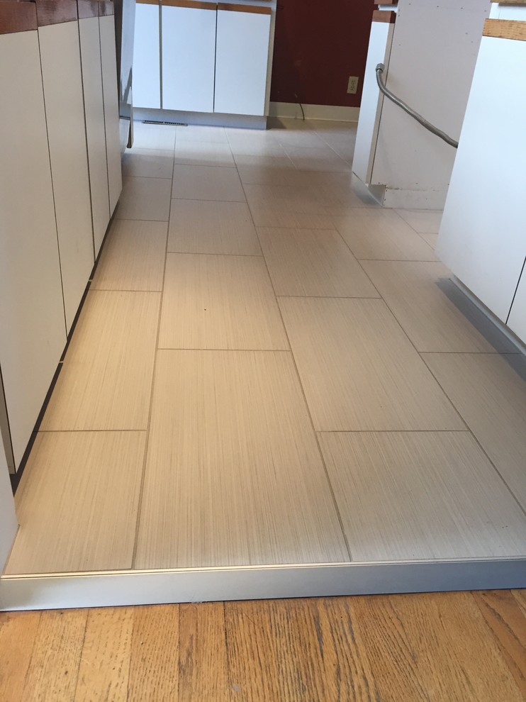 Small galley porcelain tile kitchen photo in Seattle
