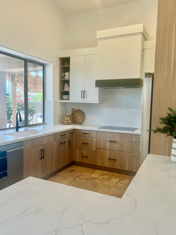 Small transitional u-shaped travertine floor, beige floor and vaulted ceiling eat-in kitchen photo in Phoenix with a drop-in sink, flat-panel cabinets, medium tone wood cabinets, quartz countertops, white backsplash, quartz backsplash, stainless steel appliances, an island and white countertops