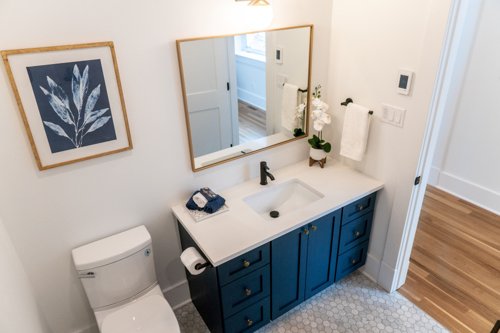 Inspiration for a mid-sized transitional kids' porcelain tile ceramic tile and white floor bathroom remodel with open cabinets, blue cabinets, a one-piece toilet, white walls, an undermount sink, quartz countertops and brown countertops