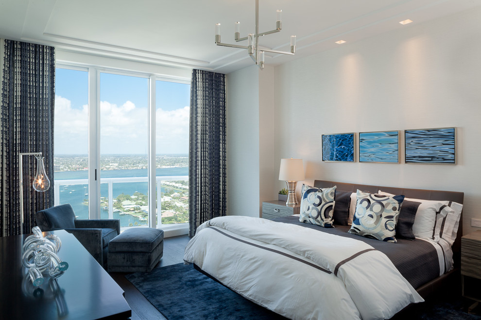 Mid-sized contemporary guest bedroom in Miami with white walls, dark hardwood floors and no fireplace.