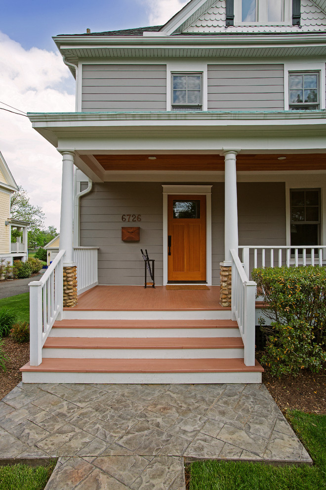 This is an example of a traditional front door in DC Metro with a single front door and a medium wood front door.