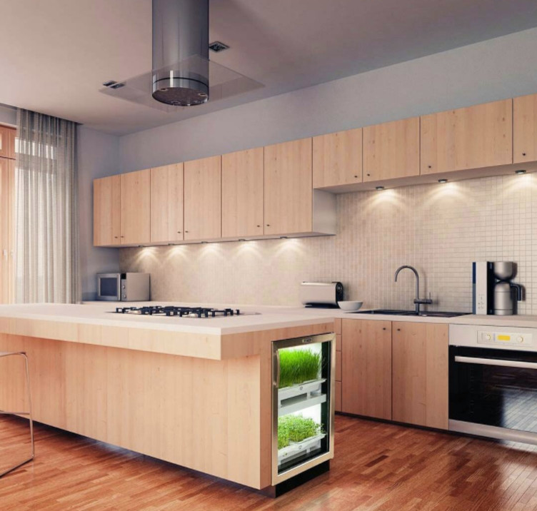 Photo of a large modern l-shaped separate kitchen in New York with an undermount sink, flat-panel cabinets, light wood cabinets, solid surface benchtops, beige splashback, mosaic tile splashback, stainless steel appliances, medium hardwood floors, with island, brown floor and beige benchtop.