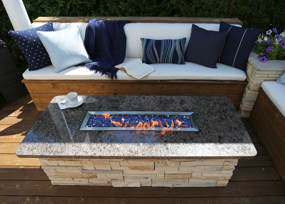Huge transitional backyard deck photo in Chicago with a fire pit and a pergola