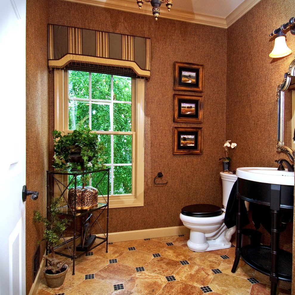 Traditional powder room in DC Metro with furniture-like cabinets, black cabinets and beige tile.