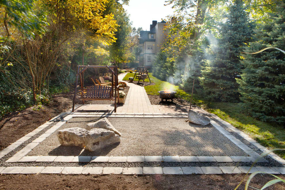 Inspiration for a contemporary backyard garden in New York with a fire feature.