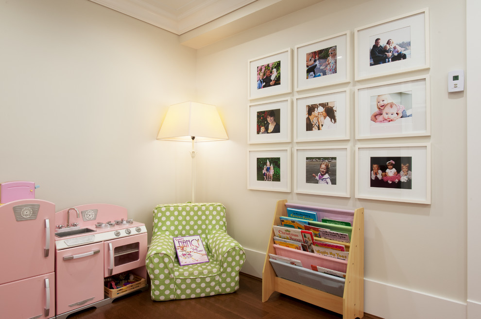 Inspiration for a mid-sized arts and crafts gender-neutral kids' playroom for kids 4-10 years old in Vancouver with grey walls and medium hardwood floors.