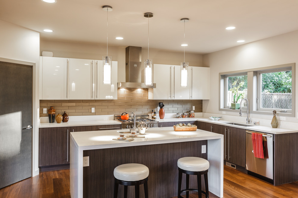 This is an example of a contemporary kitchen in Seattle with an undermount sink, flat-panel cabinets and white cabinets.