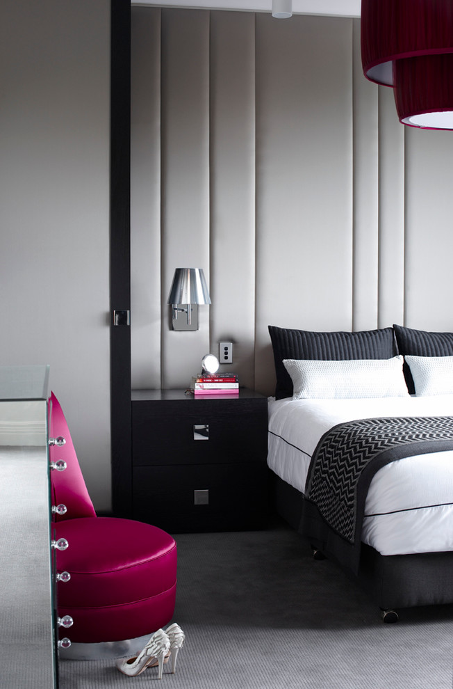 Inspiration for a mid-sized contemporary master bedroom in Sydney with grey walls and carpet.