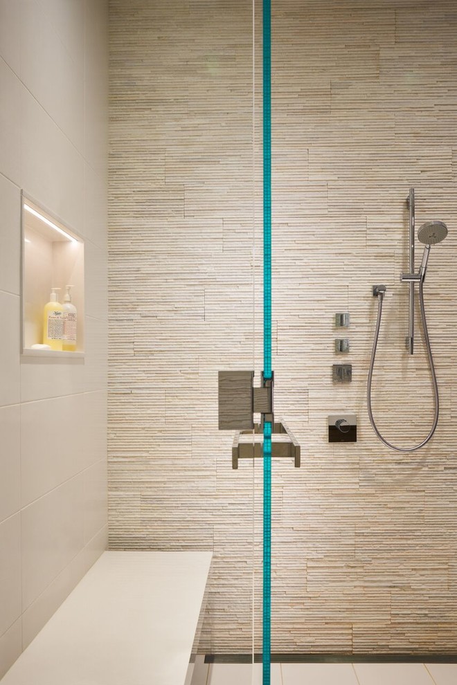 Large contemporary master bathroom in Chicago with flat-panel cabinets, brown cabinets, a curbless shower, beige tile, matchstick tile, porcelain floors, an undermount sink, solid surface benchtops, a hinged shower door, white walls and white floor.
