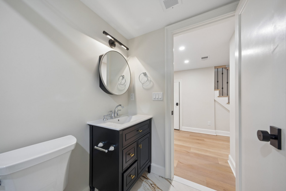 Lower-Level Bathroom with Black Vanity in Teaneck, NJ