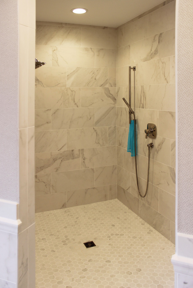 Inspiration for a large transitional master white tile and marble tile marble floor and white floor freestanding bathtub remodel in Cedar Rapids with beige walls
