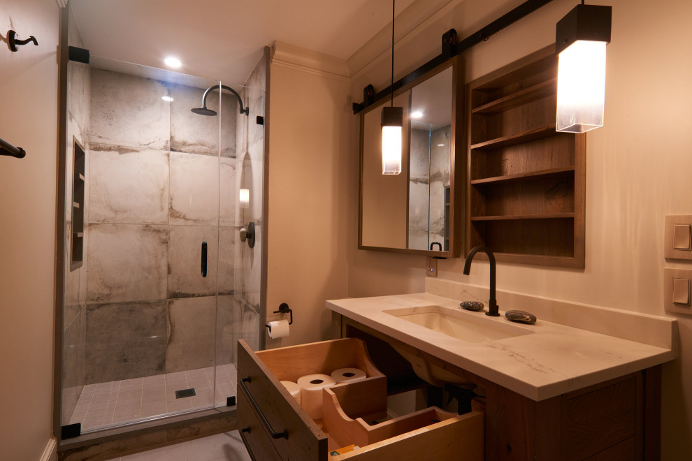 Example of a minimalist ceramic tile and single-sink corner shower design in Other with flat-panel cabinets, white cabinets, a one-piece toilet, white walls, an undermount sink, granite countertops, a hinged shower door, white countertops and a built-in vanity