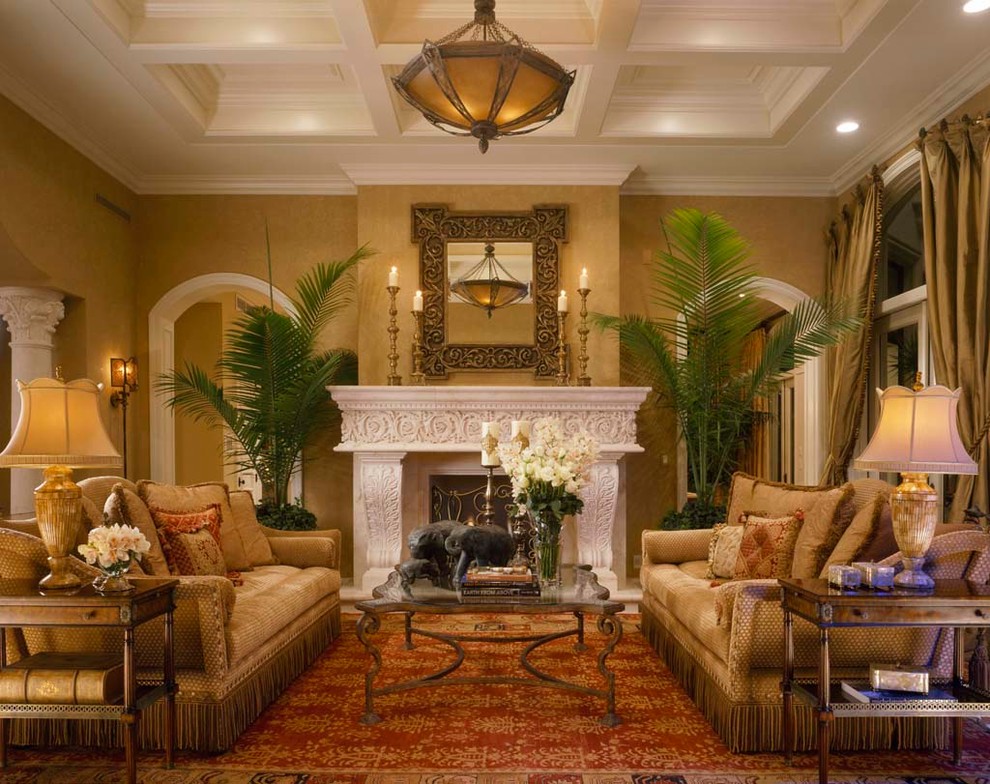 Design ideas for a large mediterranean formal open concept living room in Miami with yellow walls and a standard fireplace.