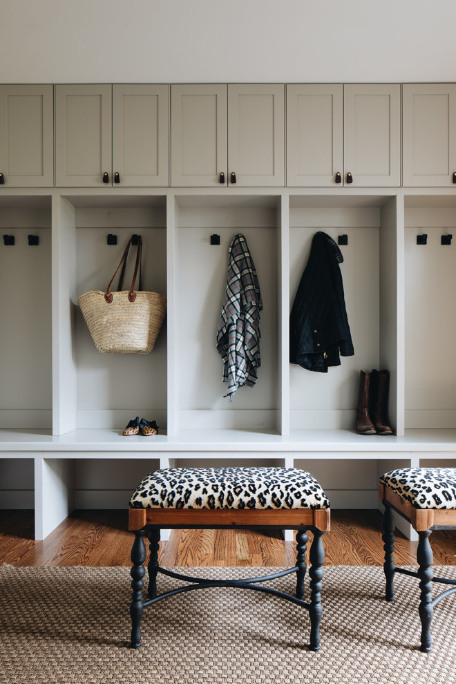 Inspiration for a large transitional mudroom in Chicago with grey walls and brown floor.
