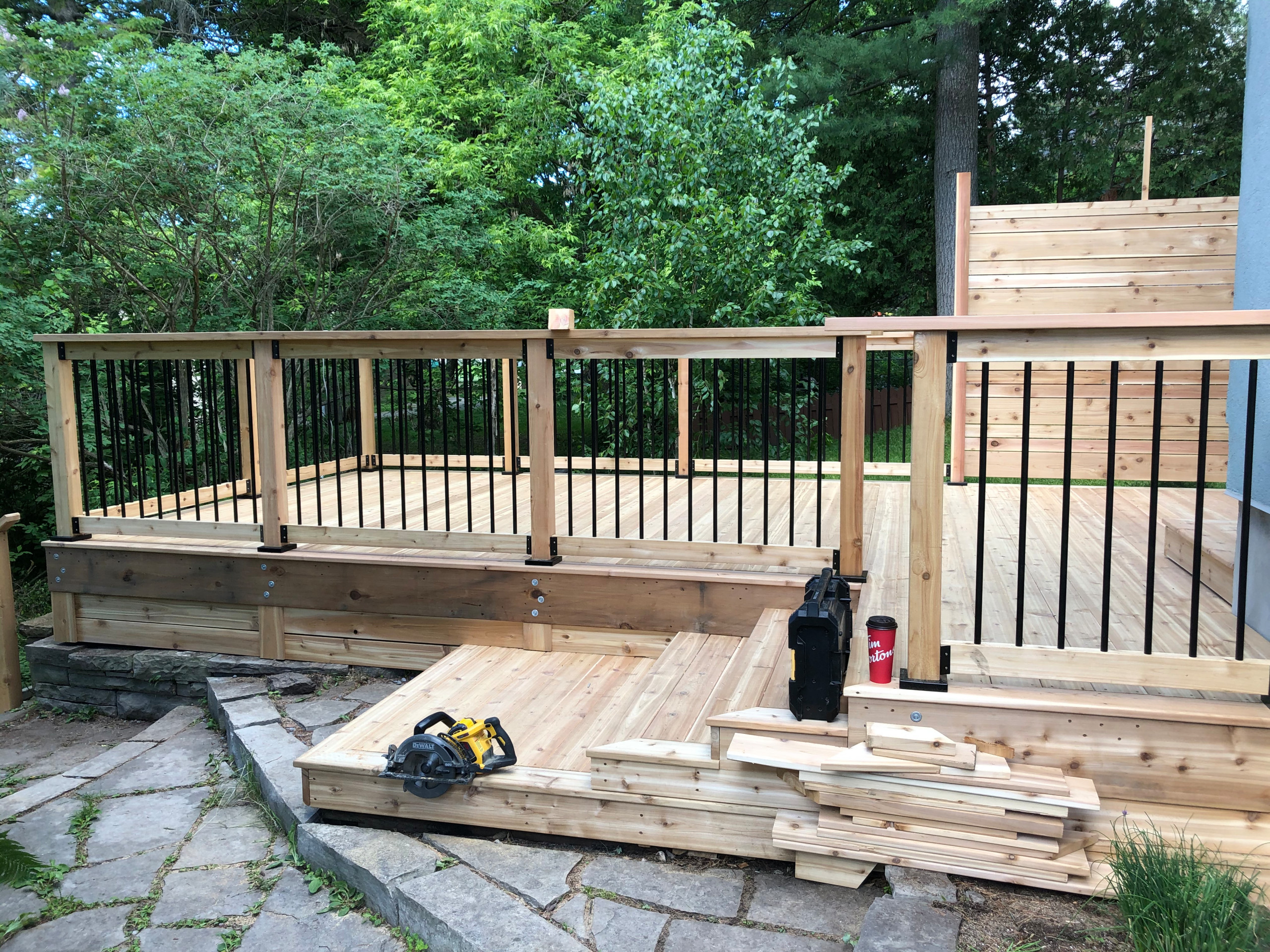 Red cedar deck with black round balusters