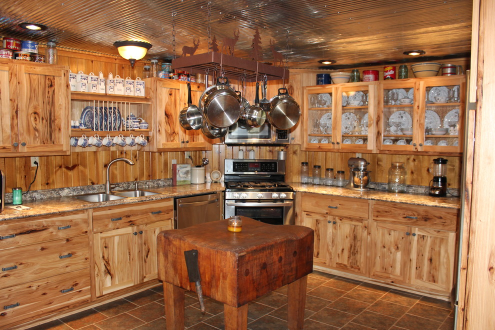 Example of a mid-sized mountain style l-shaped ceramic tile and brown floor eat-in kitchen design in Chicago with shaker cabinets, light wood cabinets, laminate countertops, an island, a double-bowl sink, stainless steel appliances, brown backsplash and wood backsplash