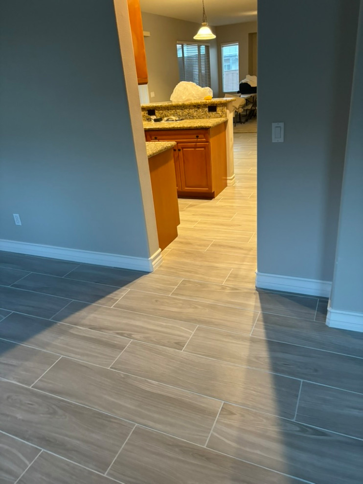 Tile plank install / laundry room cabinetry