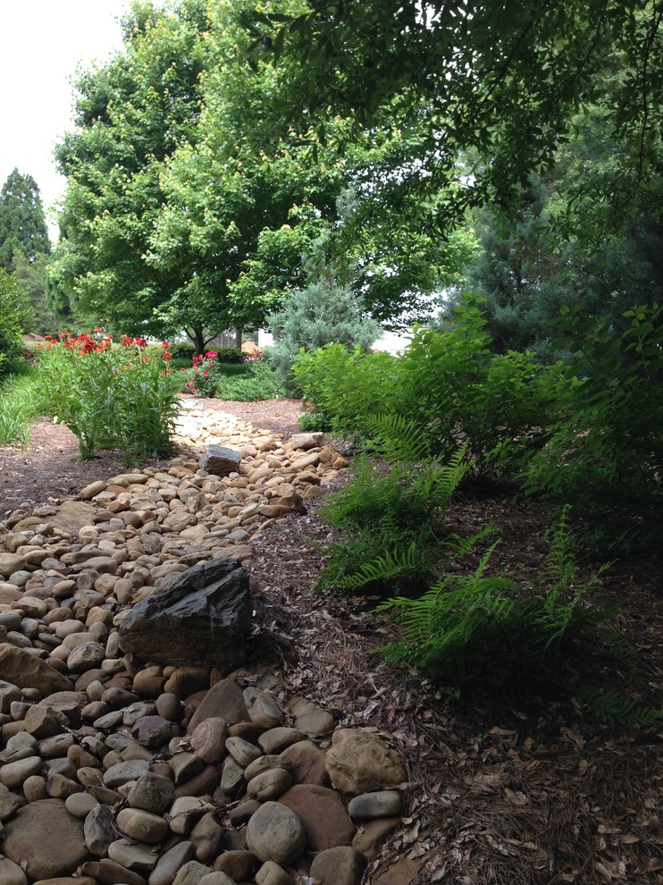 Inspiration for a rustic full sun side yard landscaping.
