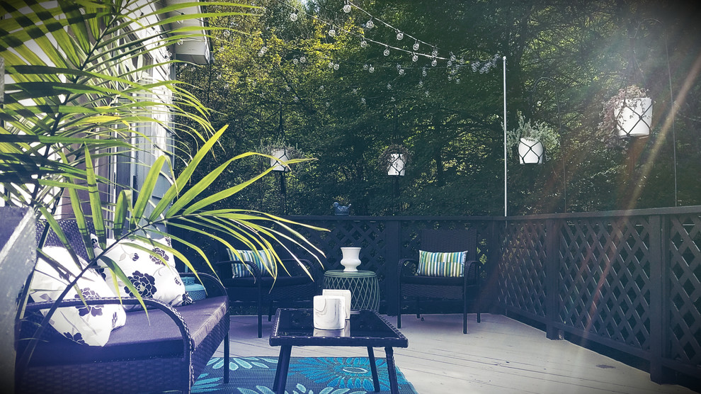Small trendy backyard deck photo