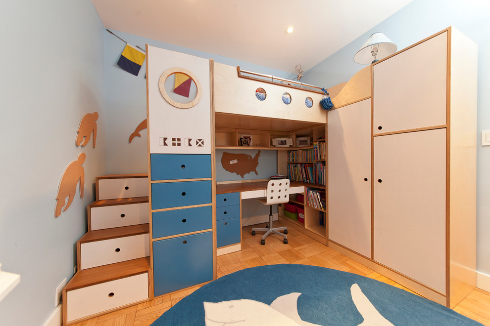 Small contemporary kids' room in New York with blue walls and light hardwood floors for boys.