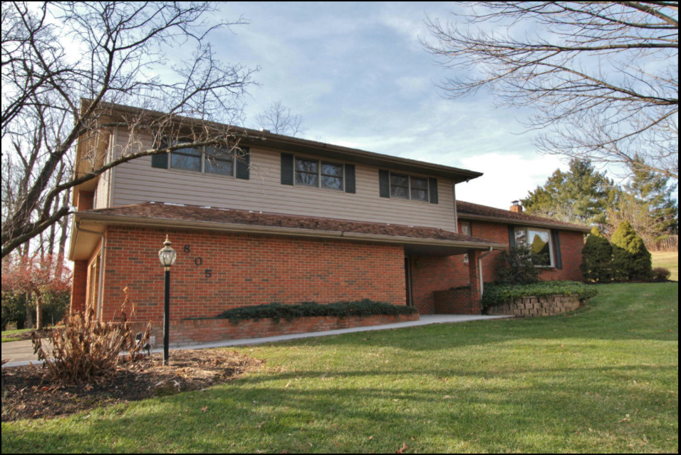 Siding/shutter color options for 1970s orange brick