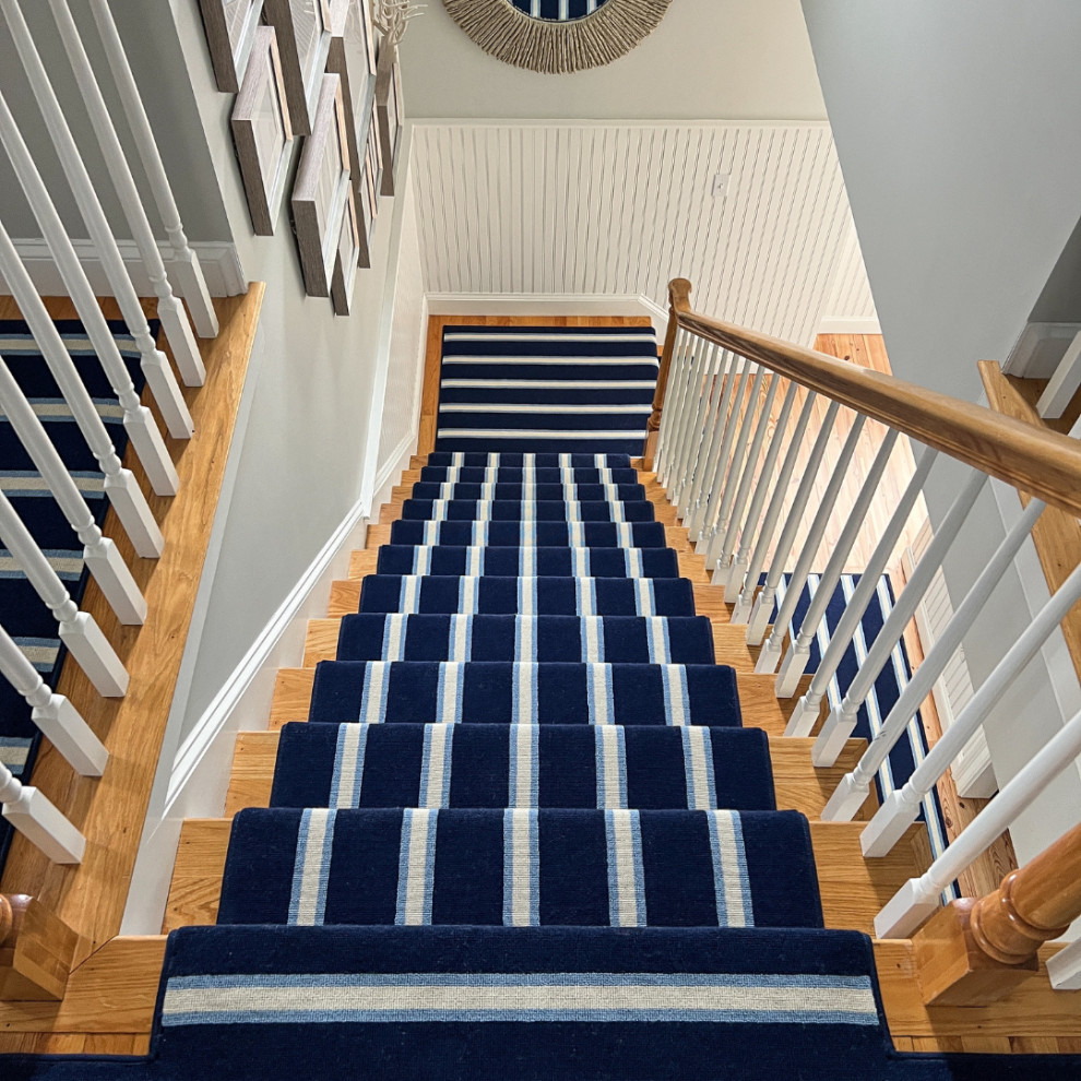 Photo of a contemporary carpeted straight wood railing staircase in Philadelphia with tongue and groove walls.