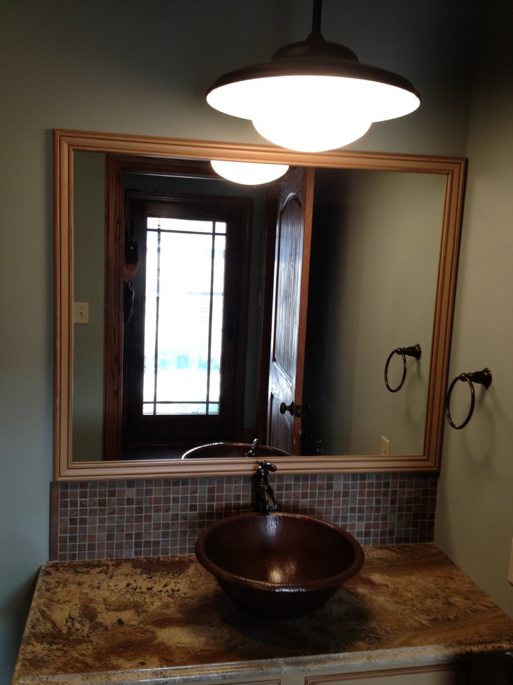 Bathroom - mid-sized brown tile and ceramic tile bathroom idea with a vessel sink, granite countertops and beige walls