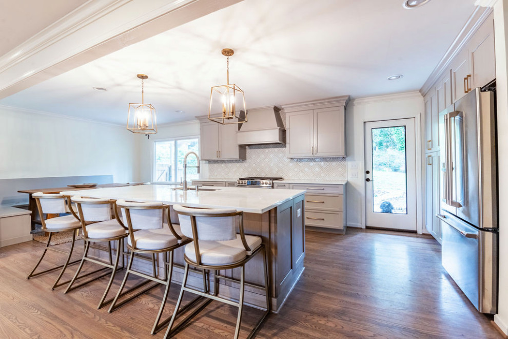 Open concept kitchen - mid-sized transitional galley open concept kitchen idea in Birmingham with shaker cabinets, gray cabinets, solid surface countertops, porcelain backsplash and an island