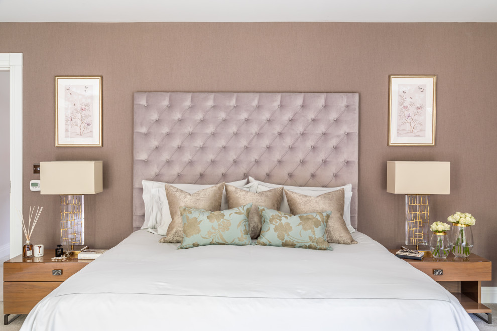 Photo of a contemporary master bedroom in Buckinghamshire with pink walls and carpet.