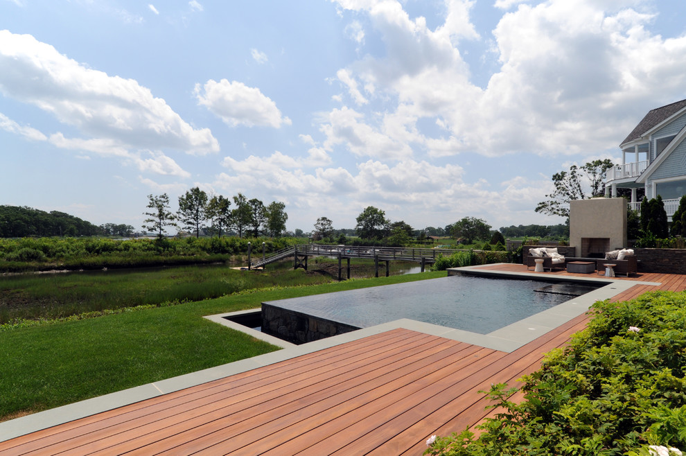 This is an example of a traditional pool in New York with decking.