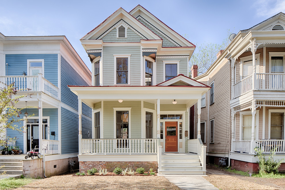 Design ideas for a traditional two-storey grey house exterior in Dallas with a gable roof.