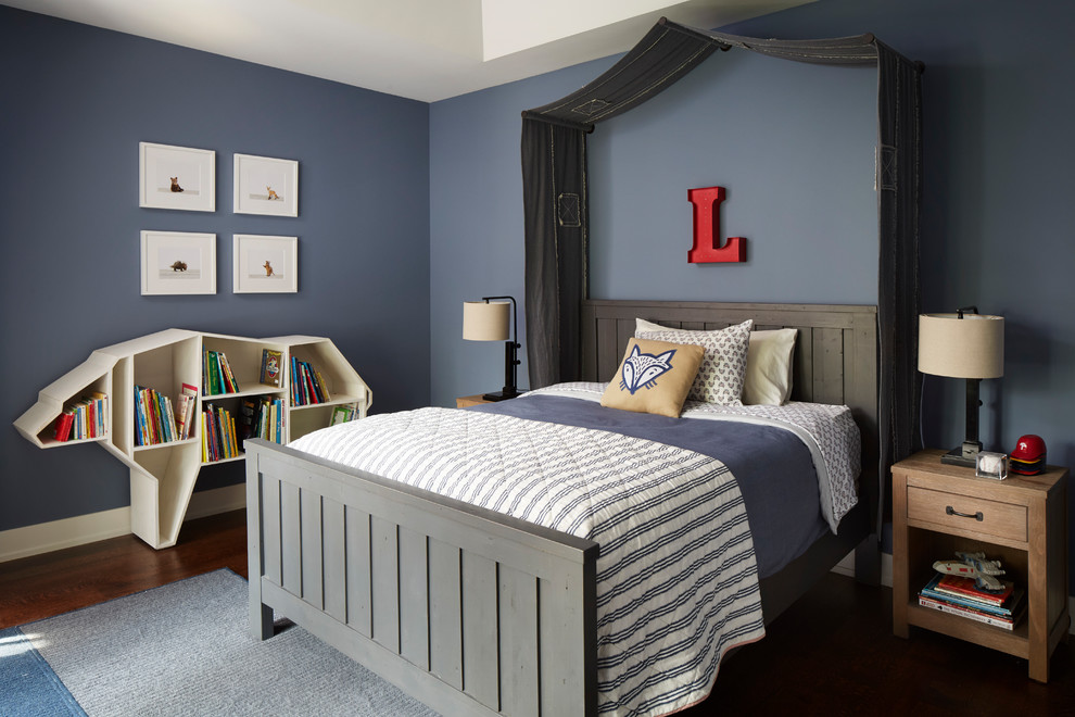 Photo of a transitional kids' bedroom for kids 4-10 years old and boys in Chicago with blue walls and dark hardwood floors.