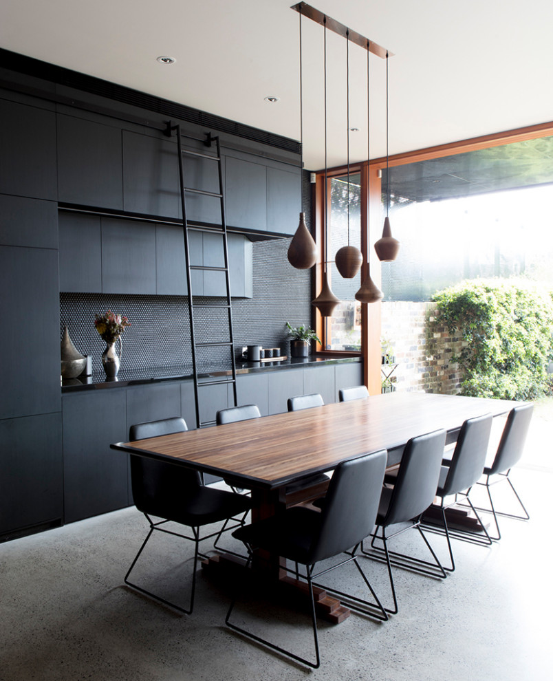 Contemporary dining room in Sydney with concrete floors and grey floor.