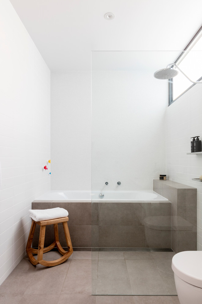 Design ideas for a mid-sized contemporary 3/4 bathroom in Sydney with recessed-panel cabinets, white cabinets, a drop-in tub, an open shower, a one-piece toilet, white tile, subway tile, white walls, ceramic floors, a drop-in sink, engineered quartz benchtops and an open shower.
