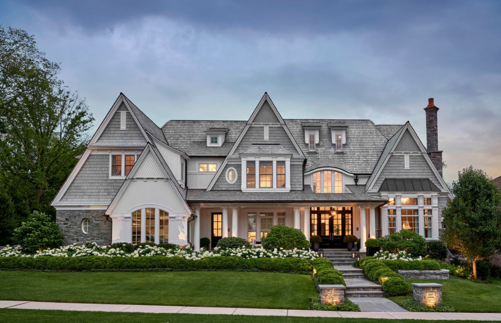 Design ideas for an expansive beach style three-storey grey house exterior in Chicago with wood siding, a gable roof, a shingle roof, a grey roof and shingle siding.