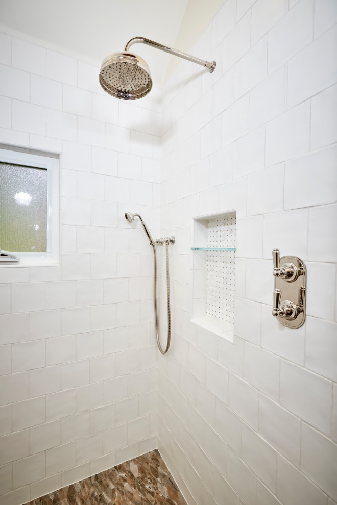 Photo of a mid-sized master bathroom in San Diego with recessed-panel cabinets, green cabinets, an open shower, a wall-mount toilet, white tile, cement tile, white walls, porcelain floors, an undermount sink, engineered quartz benchtops, brown floor, a hinged shower door, white benchtops, an enclosed toilet, a double vanity, a built-in vanity, exposed beam and planked wall panelling.
