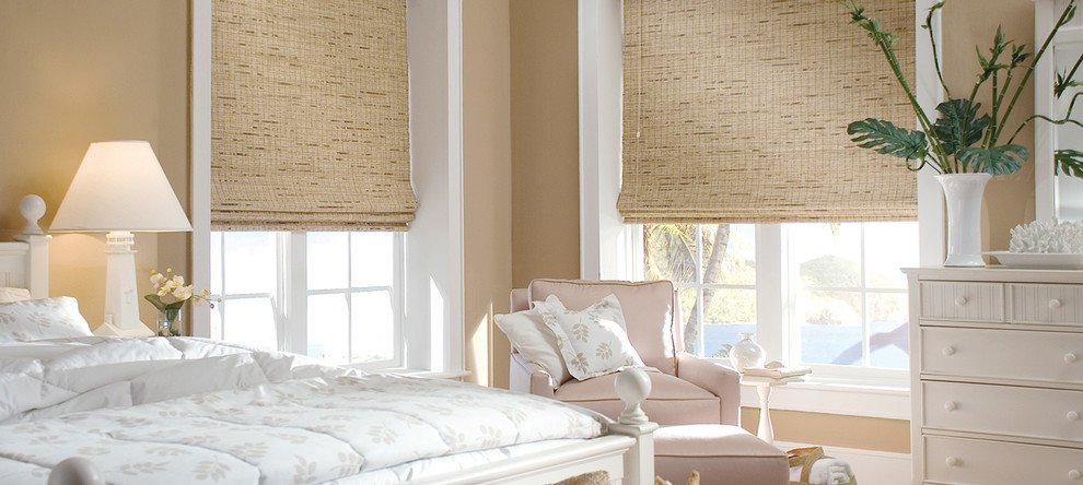 Inspiration for a mid-sized beach style master bedroom in Toronto with beige walls and no fireplace.