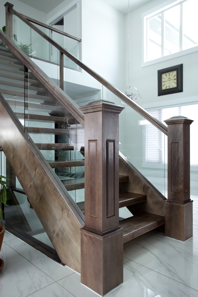 Inspiration for a contemporary wood straight staircase in Edmonton with open risers.