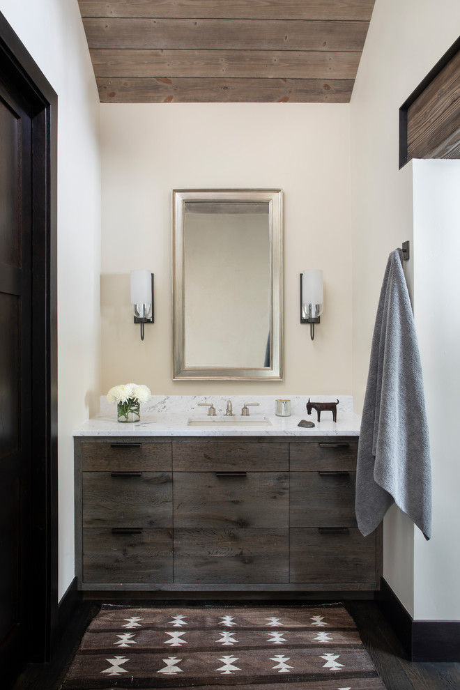 This is an example of a modern master bathroom in Other with dark wood cabinets, gray tile, beige walls, dark hardwood floors, granite benchtops, brown floor and grey benchtops.