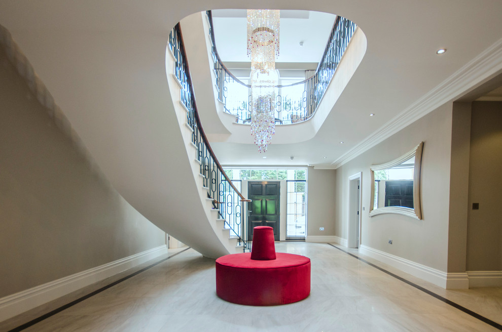 Photo of an expansive contemporary hallway in Berkshire with beige walls and grey floor.
