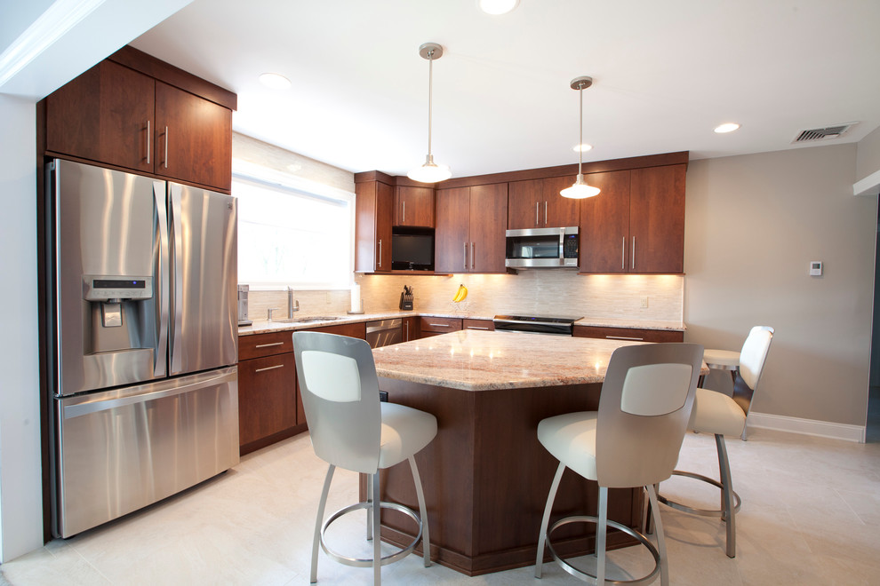 Photo of a large contemporary l-shaped eat-in kitchen in New York with a drop-in sink, flat-panel cabinets, dark wood cabinets, granite benchtops, beige splashback, ceramic splashback, stainless steel appliances, linoleum floors, with island and beige floor.