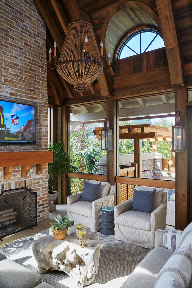 Photo of a beach style verandah in Other with a fire feature and tile.